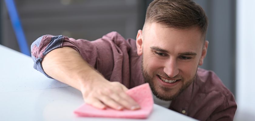 Man wiping a surface