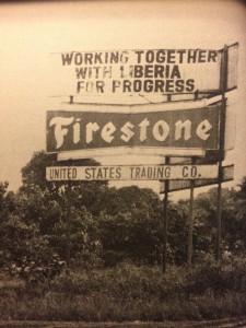 Sign in Firestone plantation in Liberia which reads, Working together with Liberia for Progress: Firestone. United States Trading Co.