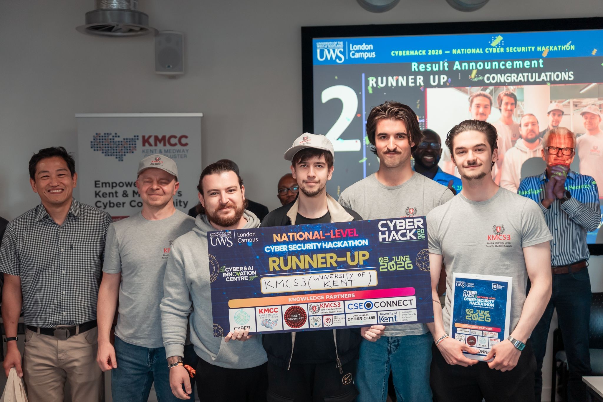CyberHack2026 - Team KMCS3 receiving prize