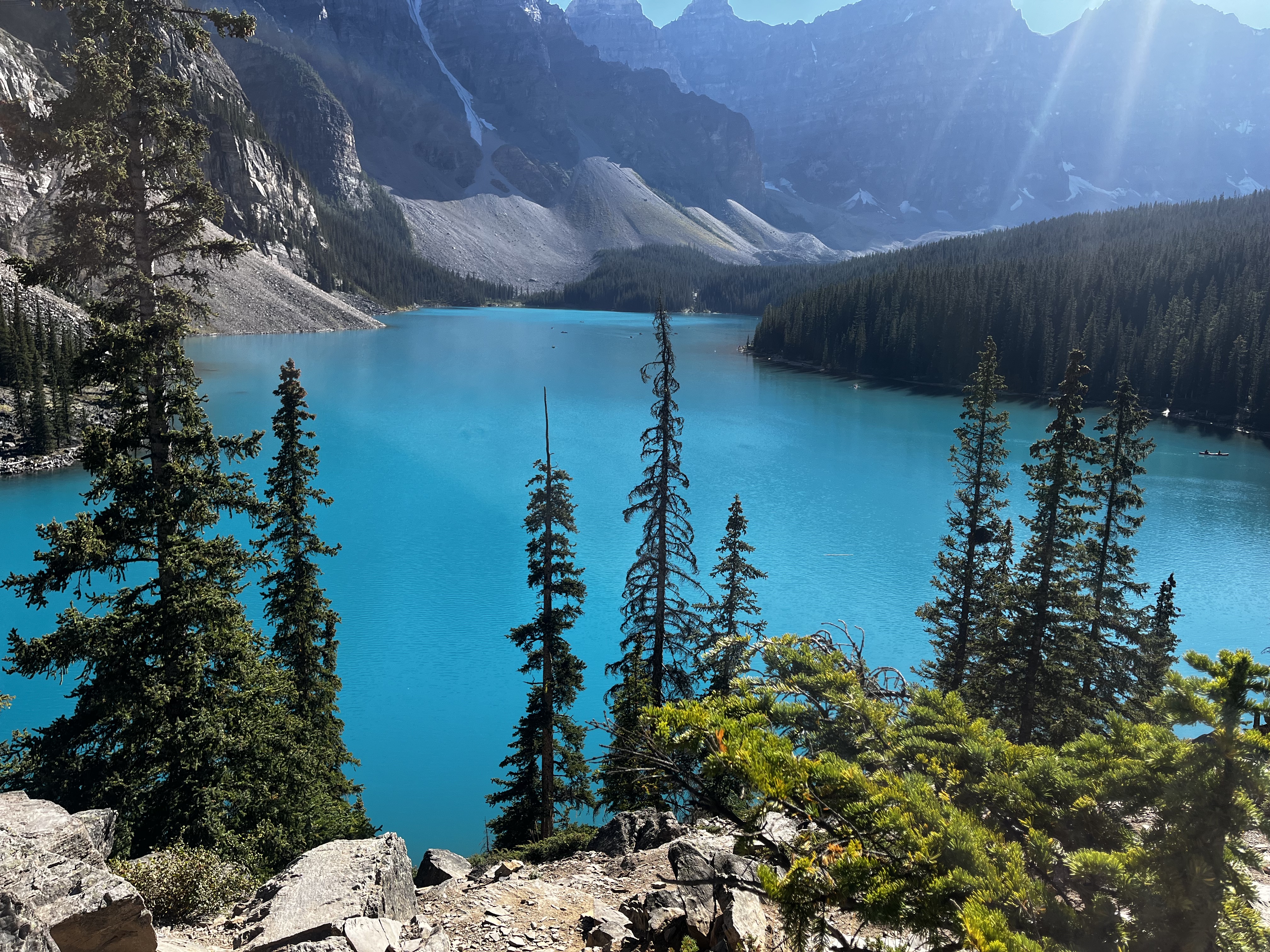 Blue lake with trees and mountains