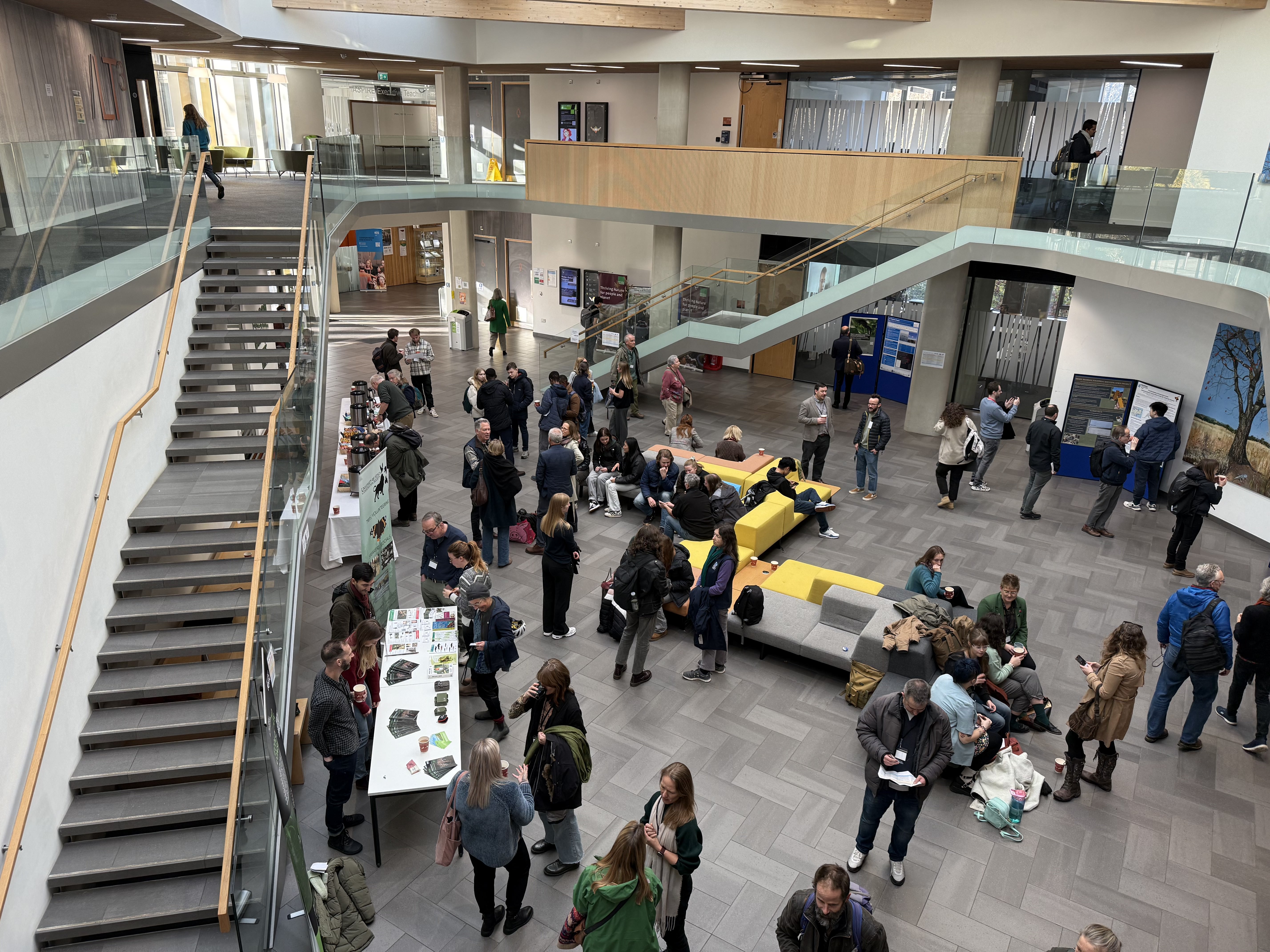 A gathering of people in a foyer space