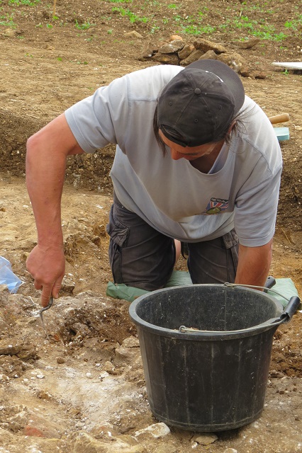 Jonathan at work on a section of the wall foundations