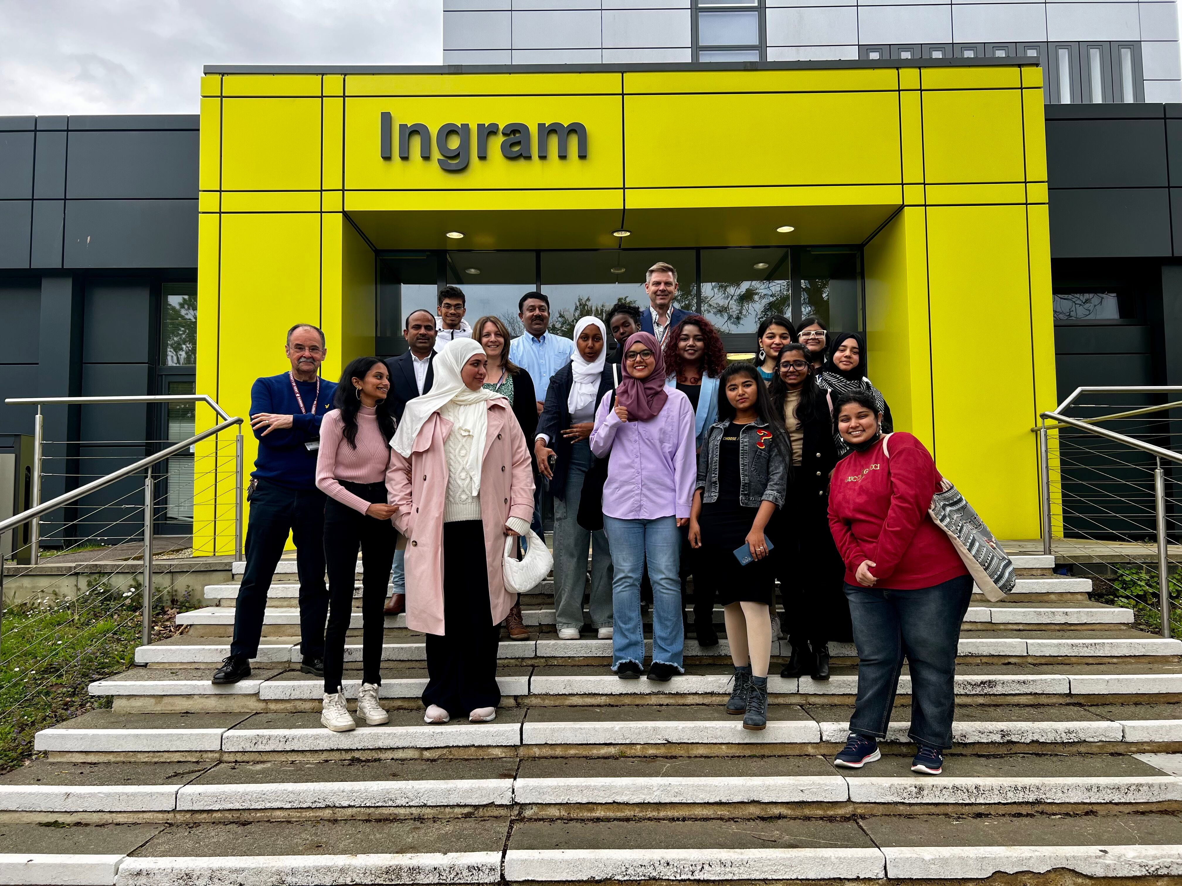 Amity students pose together on the steps of the Ingram building