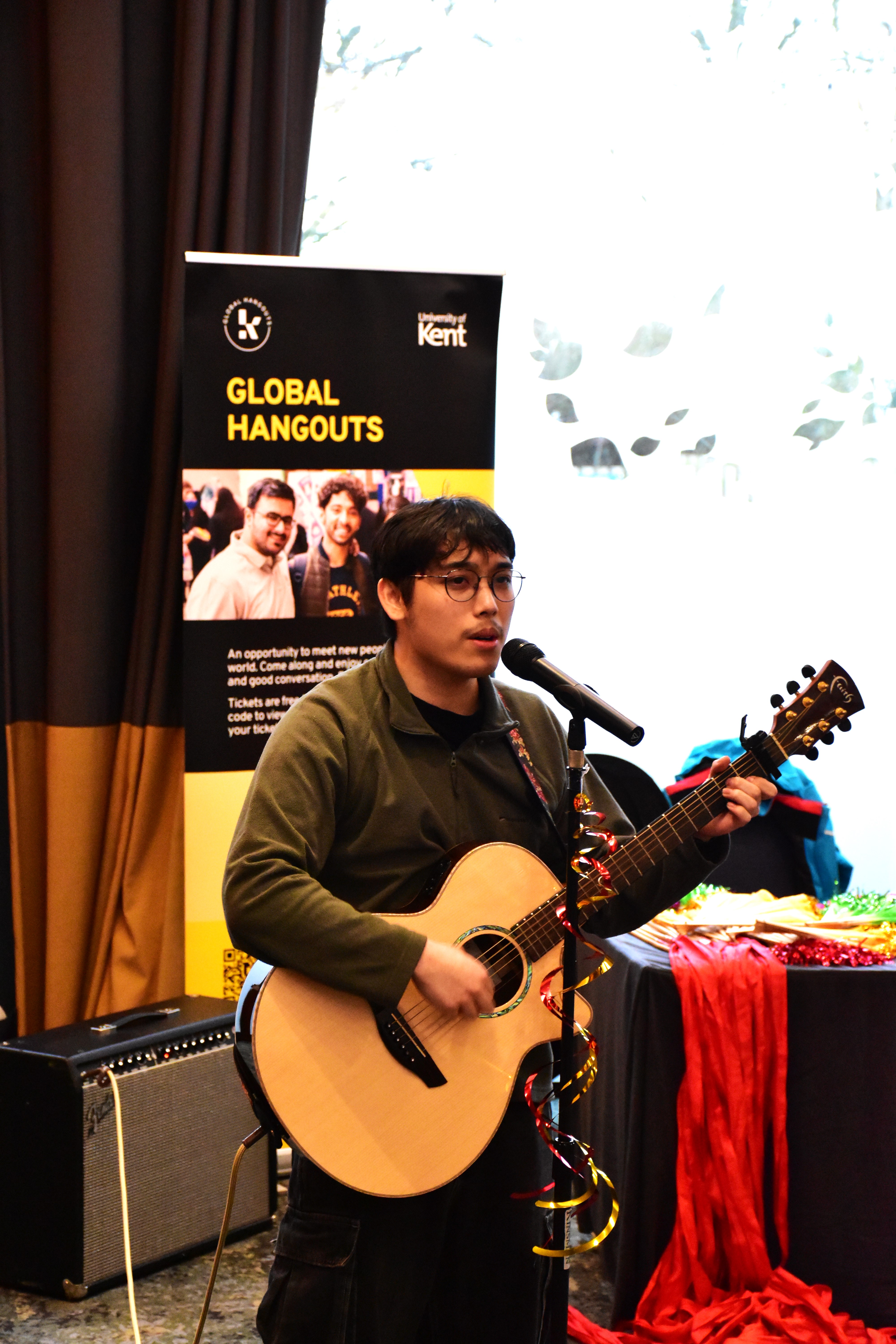 A student playing guitar