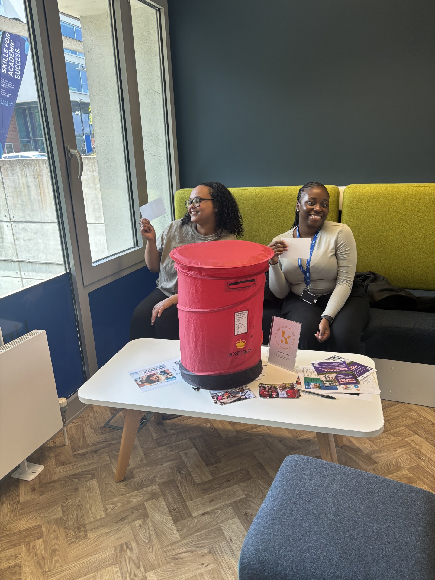 Medway students writing postcards home