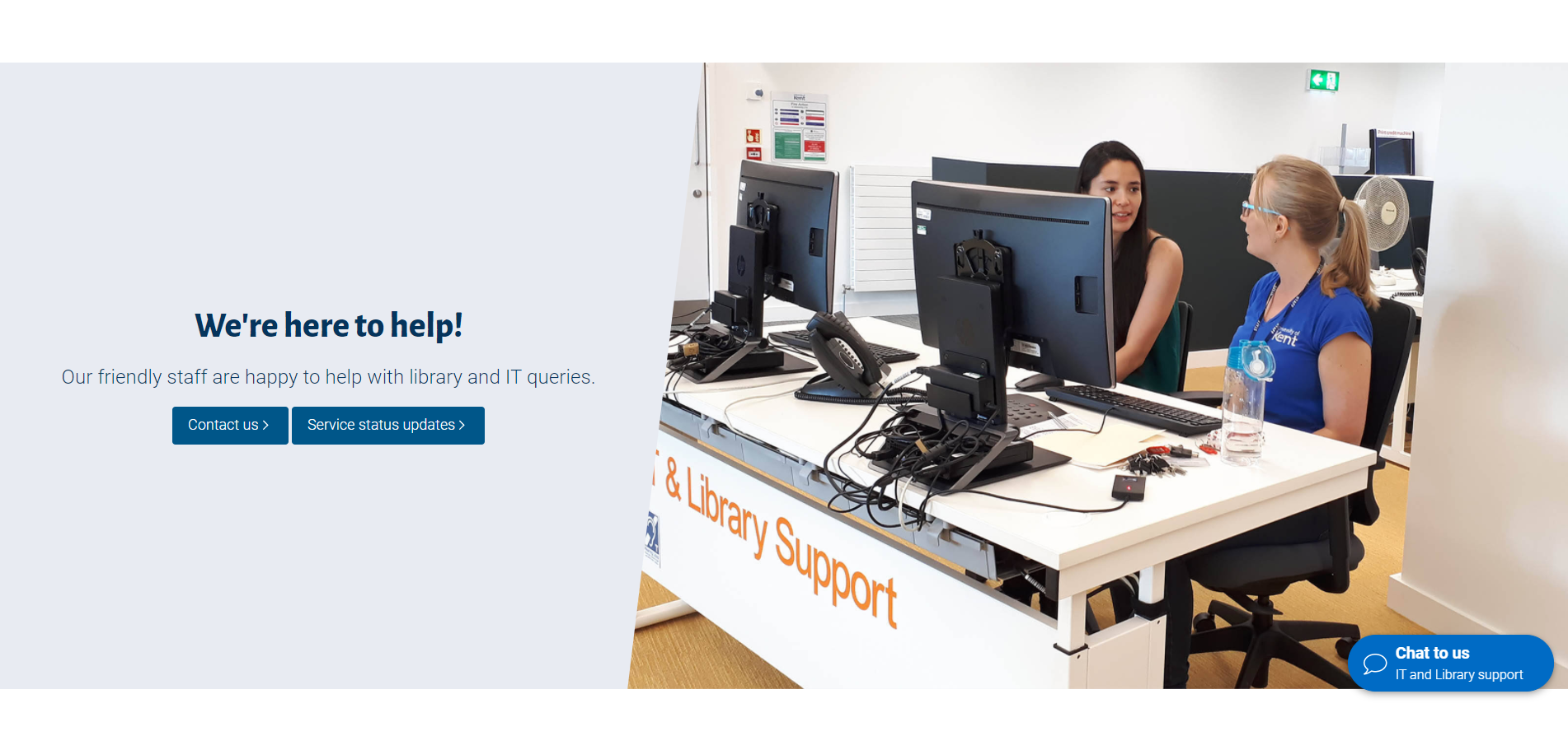Image of student with staff member at the IT & Library Support Desk in the Templeman Library