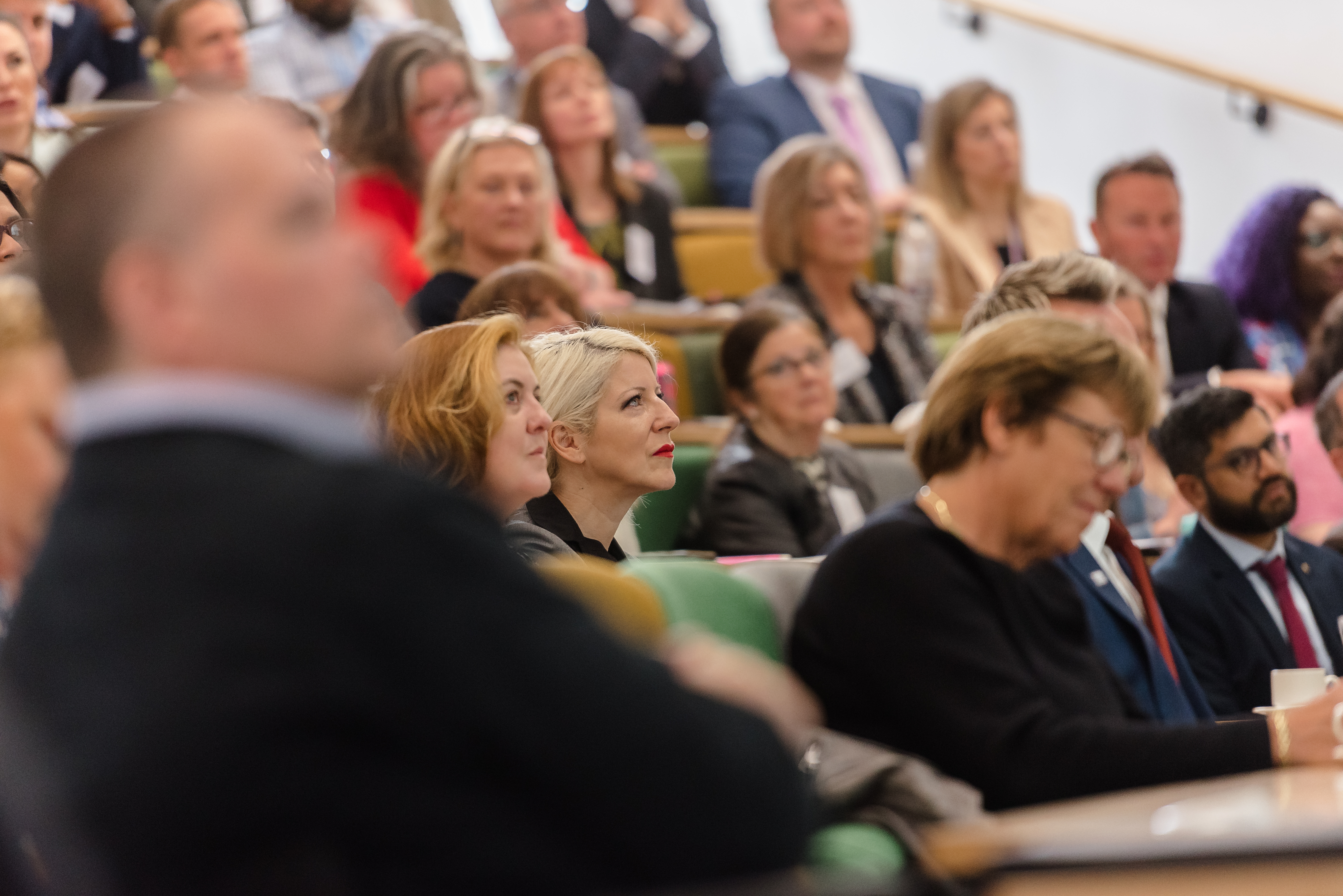 Delegates sat in a lecture theatre watching the Business Summit 