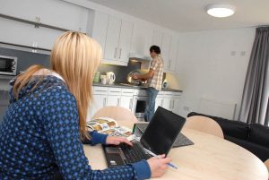 An image of students in a shared student flat at the University of Kent