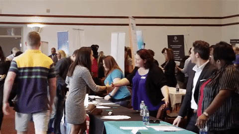 An image of students networking at a graduation event