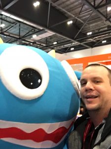 Learning Technologist selfie with company mascot