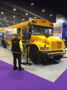 Picture of yellow American School bus in the BETT tradeshow