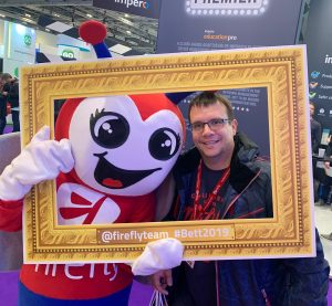 Shot of Steve Ganfield with the Firefly company mascot using a selfie photo frame