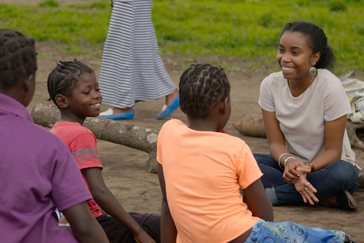 Dominique Gonçalves laughing with a Girls Club group in Gorongosa.