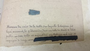 The fragment of leather and it's intriguing caption (in French)