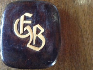 The back of the cigarette box carved by Brosig with his initials