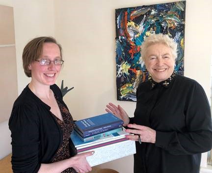 Beth and Dame Stephanie passing on the first items from the Shirley Foundation Collection 