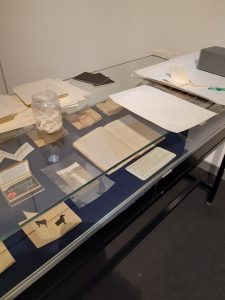 Display case with elements from the Diaries of the Here and Now exhibition