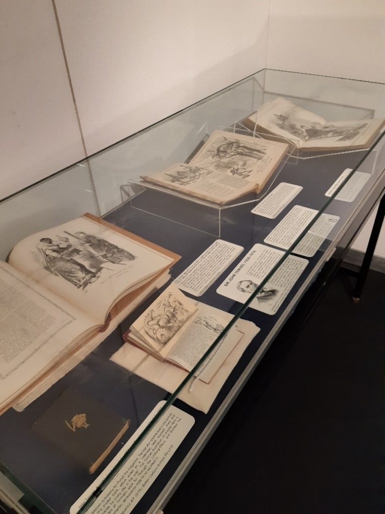 Display case with elements of the Politics in Wonderland: Sir John Tenniel at 200 exhibition
