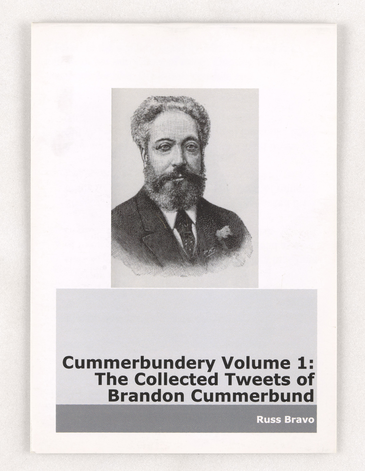 A photograph of the cover of a zine, featuring a portrait of an older man. 