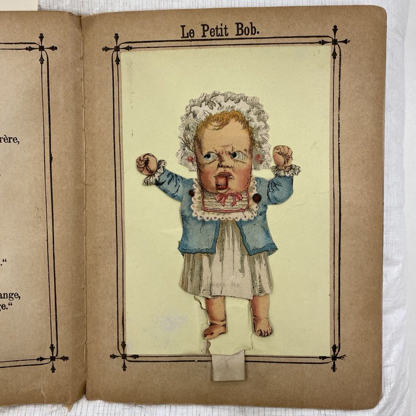 Image of a pop-up page titled Le Petit Bob from Les grotesques, depicting a baby having a tantrum.. 