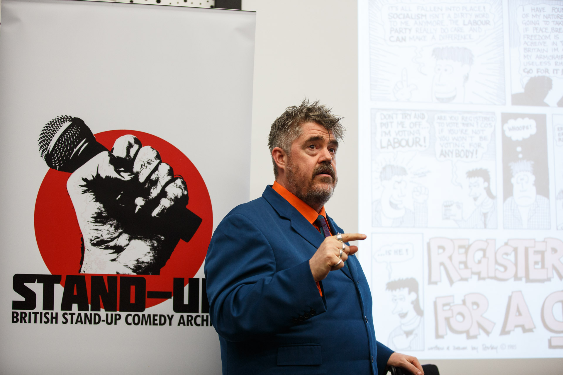 Phill Jupitus talking about a Red Wedge Comedy leaflet which he cartooned for (as Porky the Poet). Photo Matt Wilson