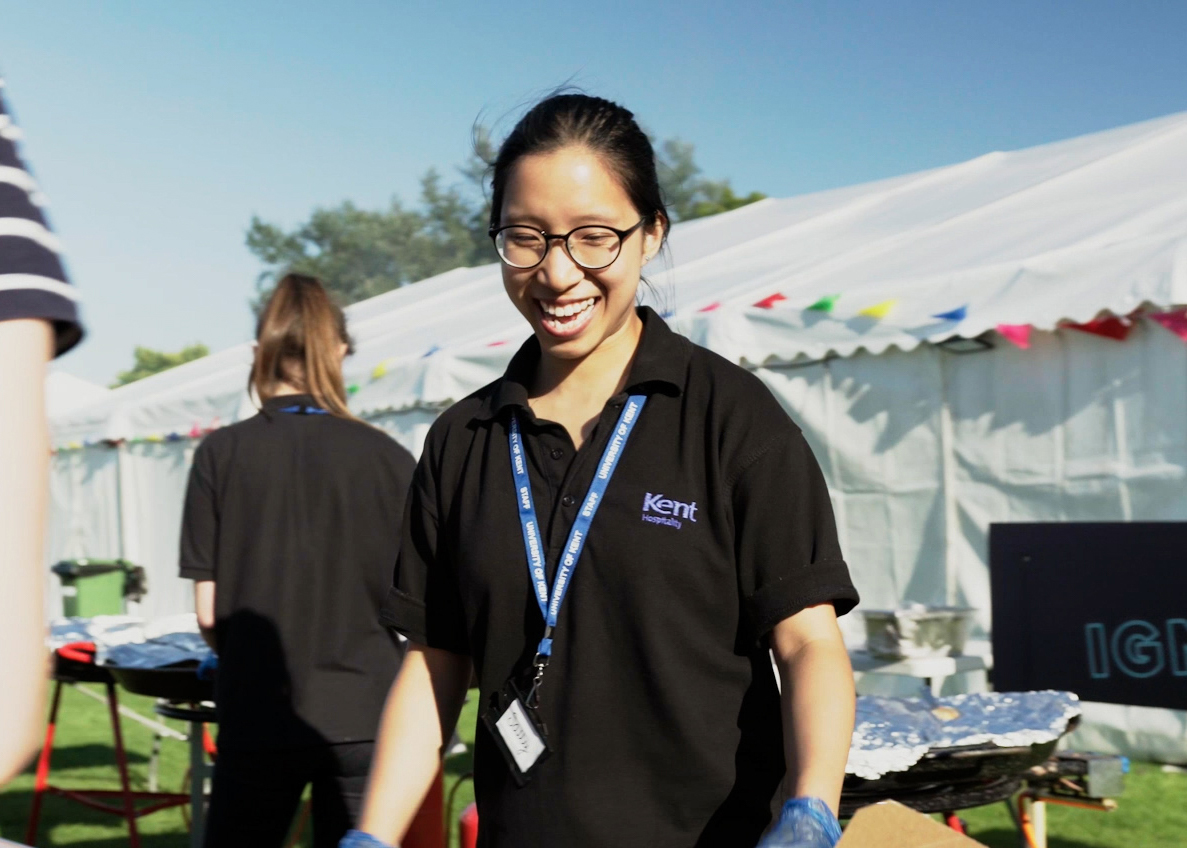 Member of staff helping at an outside event