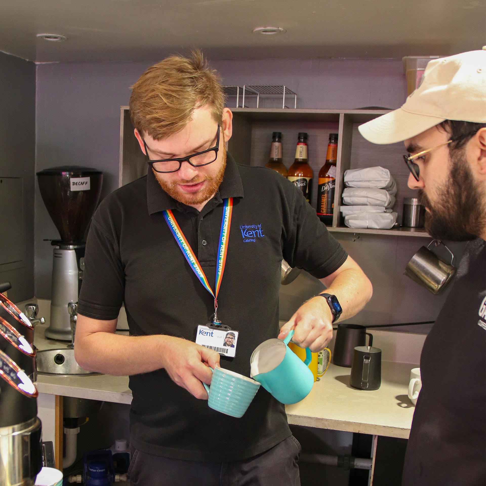 Daniel Johnson tries out his new coffee skills with the Garage Coffee team