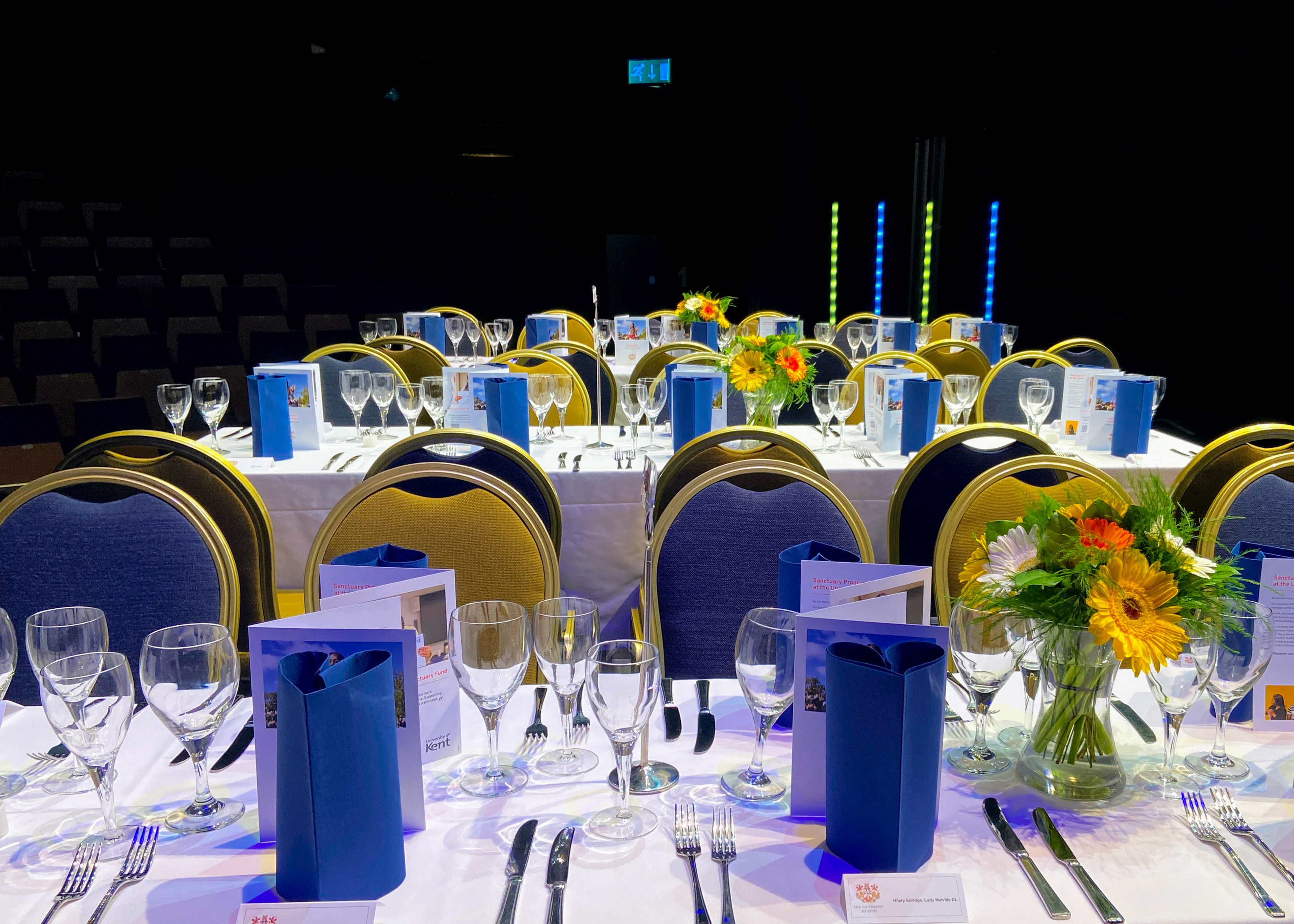 Tables set up with a blue and yellow colour scheme