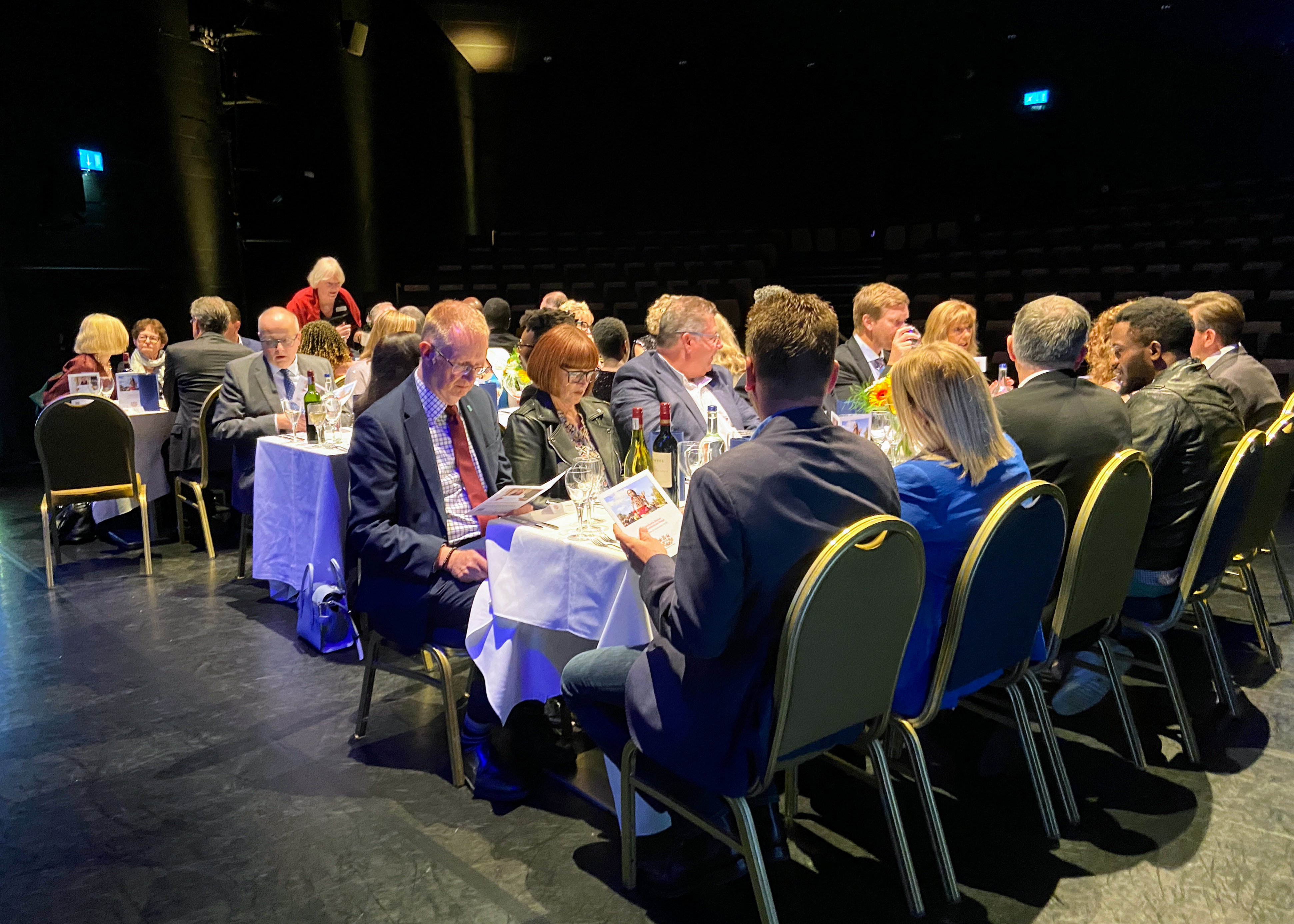 A dinner takes place on the Gulbenkian Theatre Stage