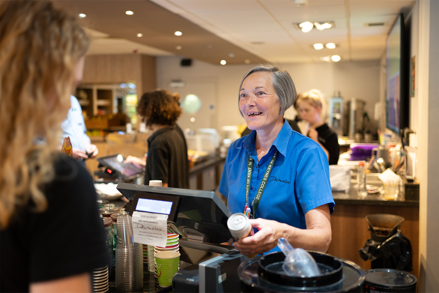 A staff member at Dolche Vita chats to a customer