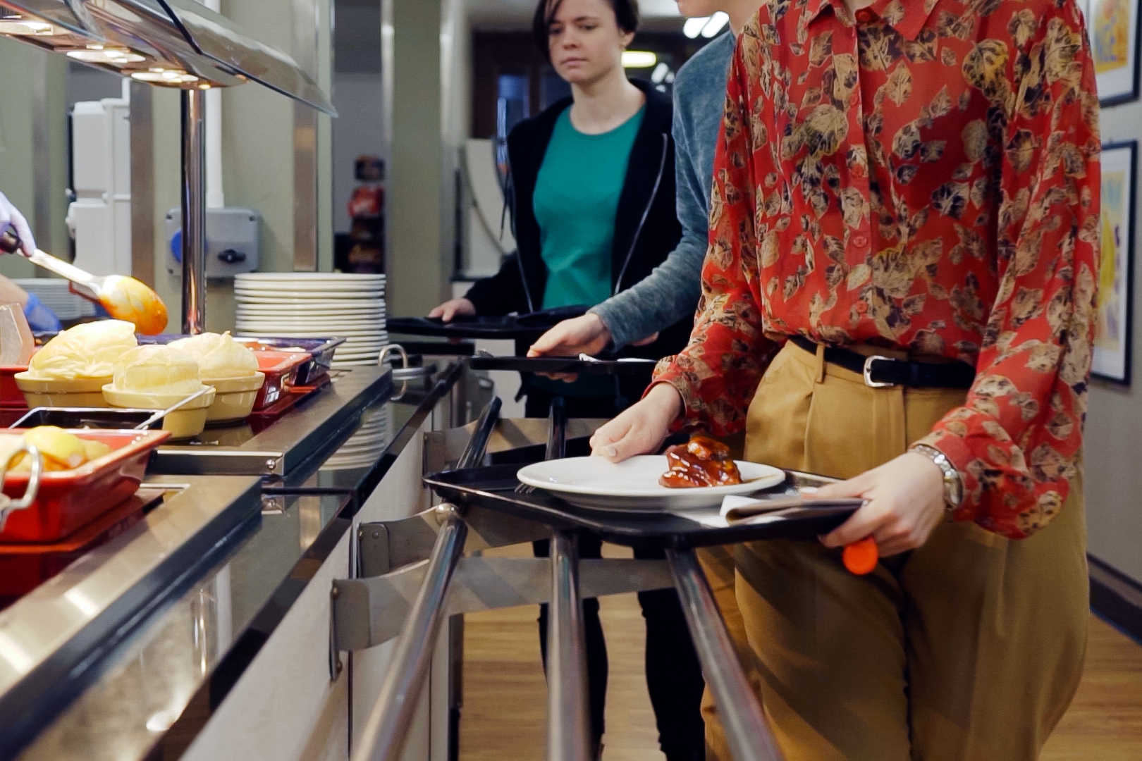 Students line up in the servery