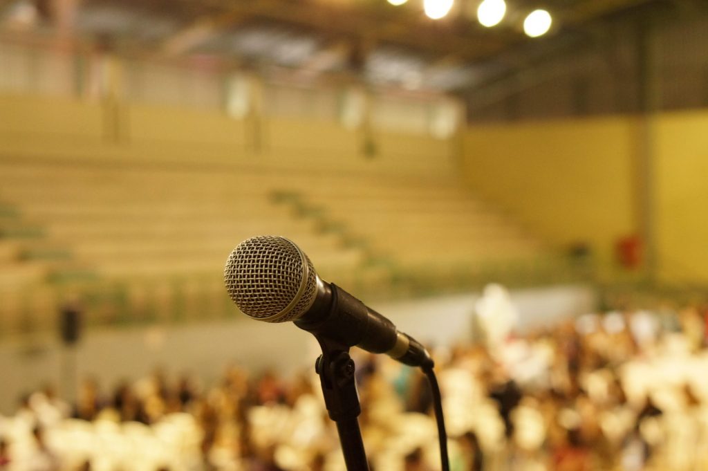 Microphone in front on an audience