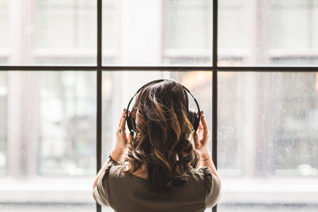 headphones-woman-window