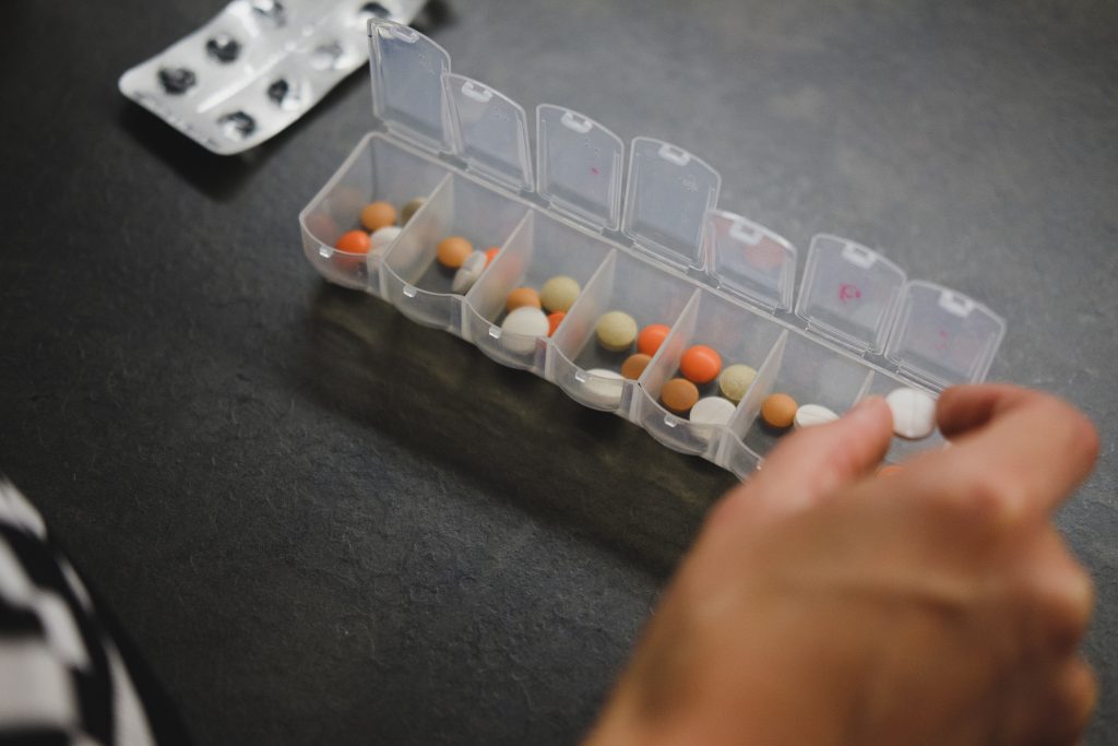 tablets being sorted in medicine box