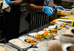 Food being prepared in foil containers