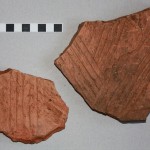 Fragments of box flue tiles; the larger piece came from Feature 2020, and shows sooting over its interior surface indicating use.