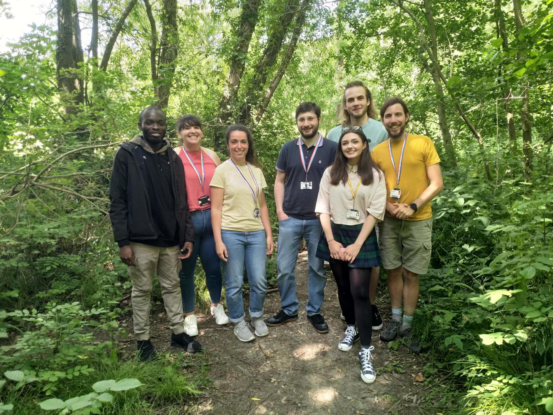 Project team members standing in woodland