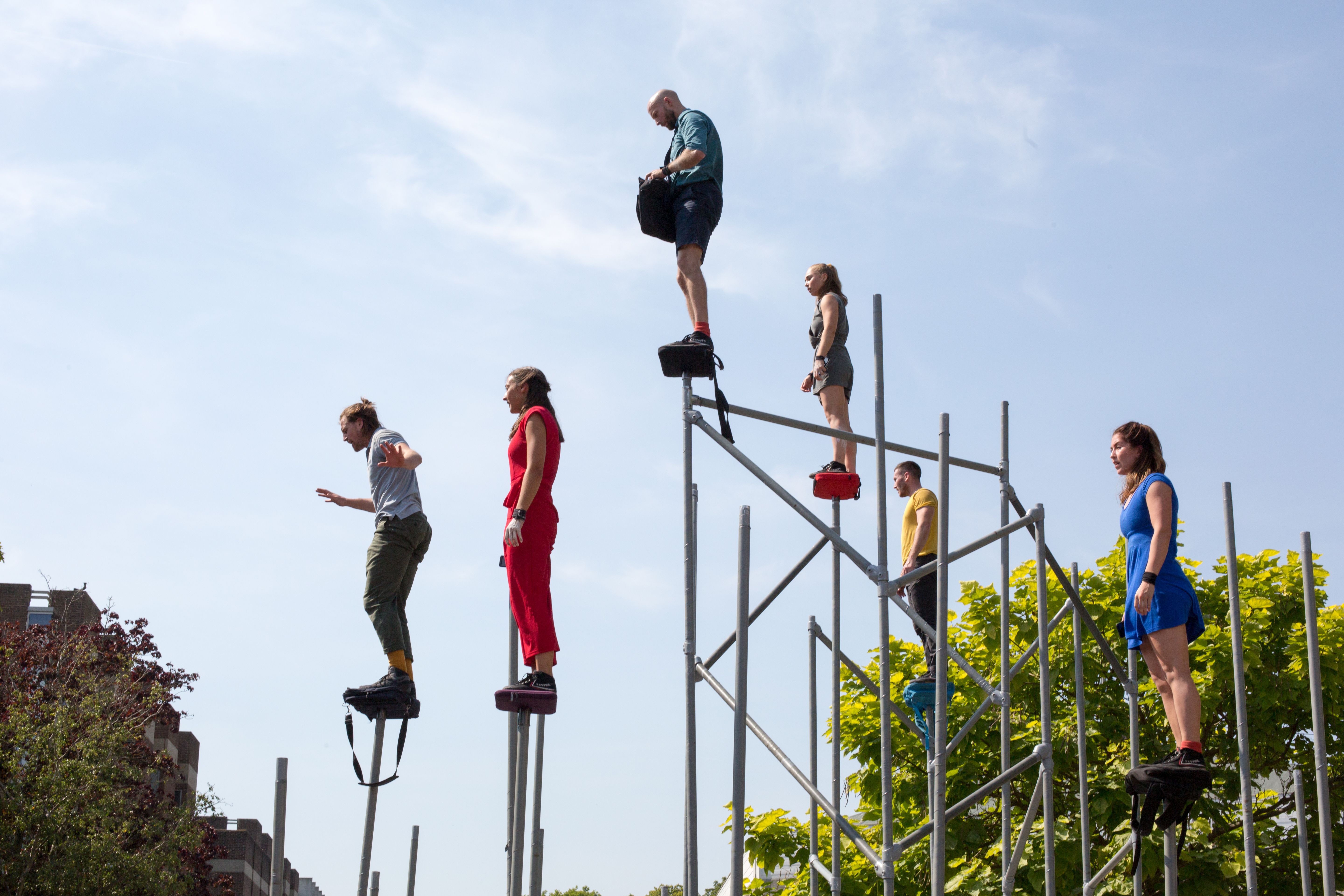 Performers elevated on a scaffold structure