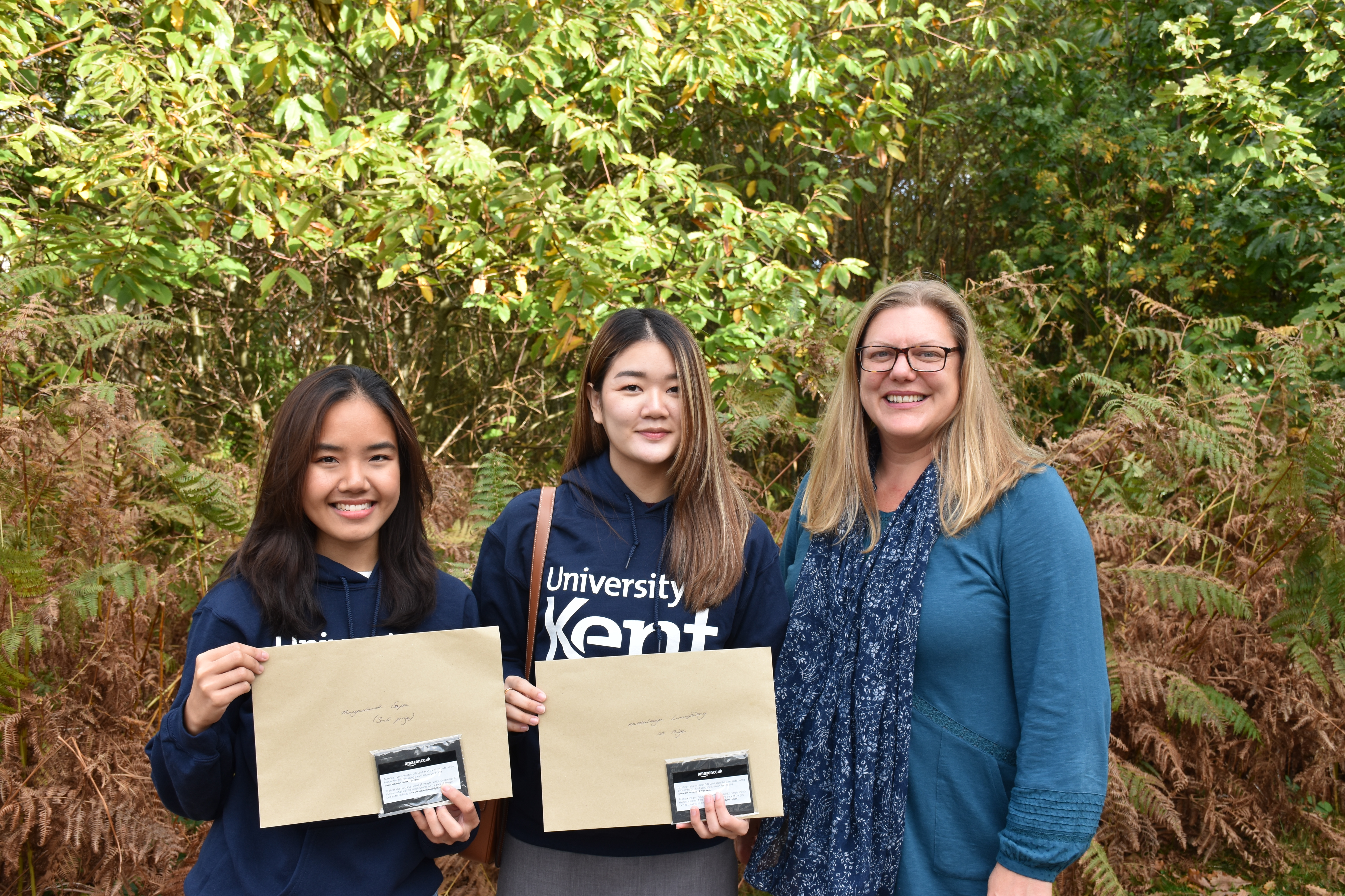 Pre-sessional students collect video competition prizes