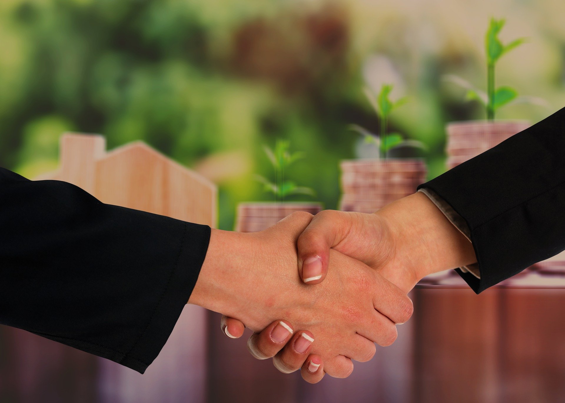 photo of two people shaking hands