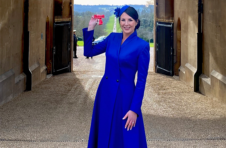 Laura collecting her MBE