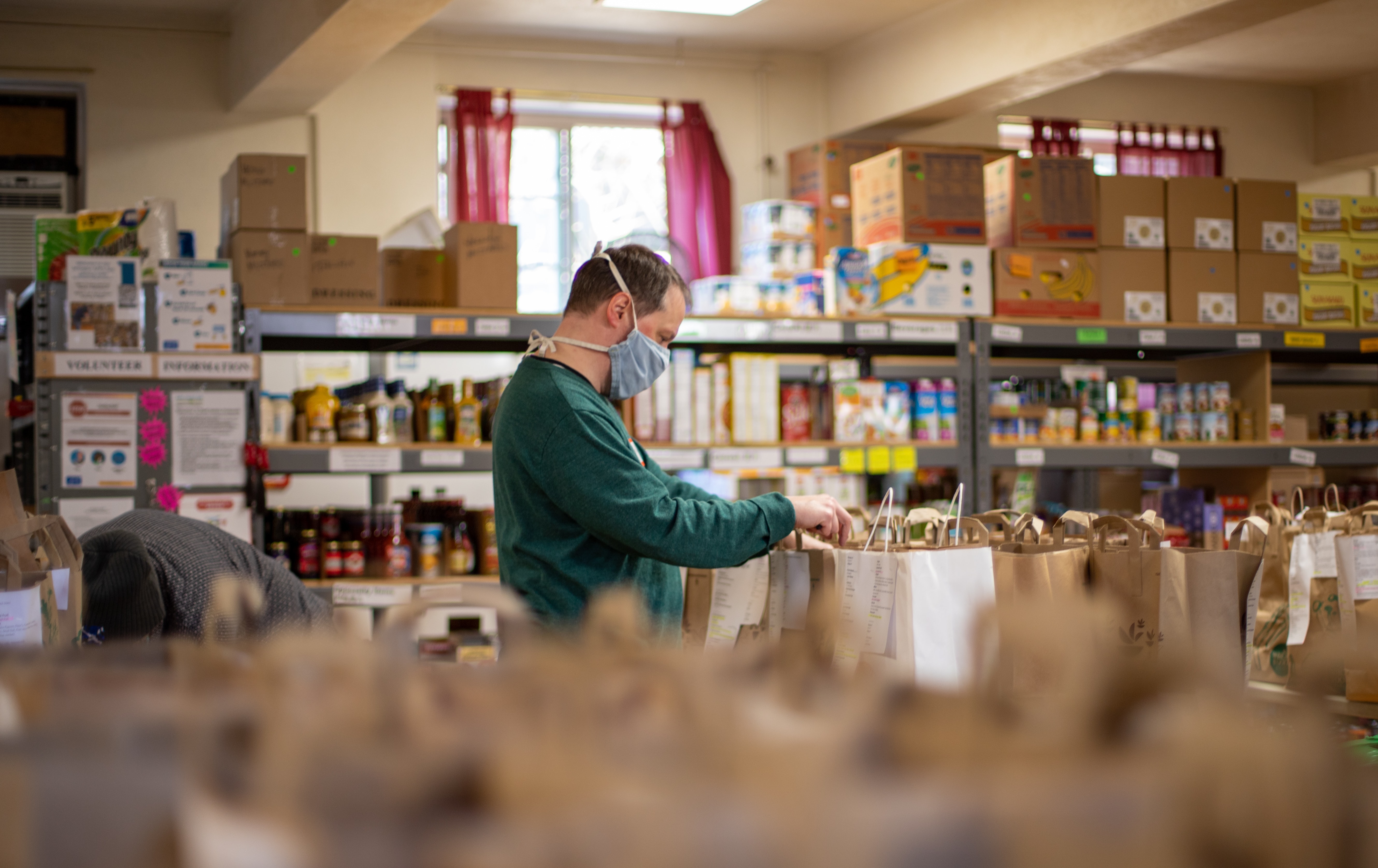 a photo of a person working in a foodbank
