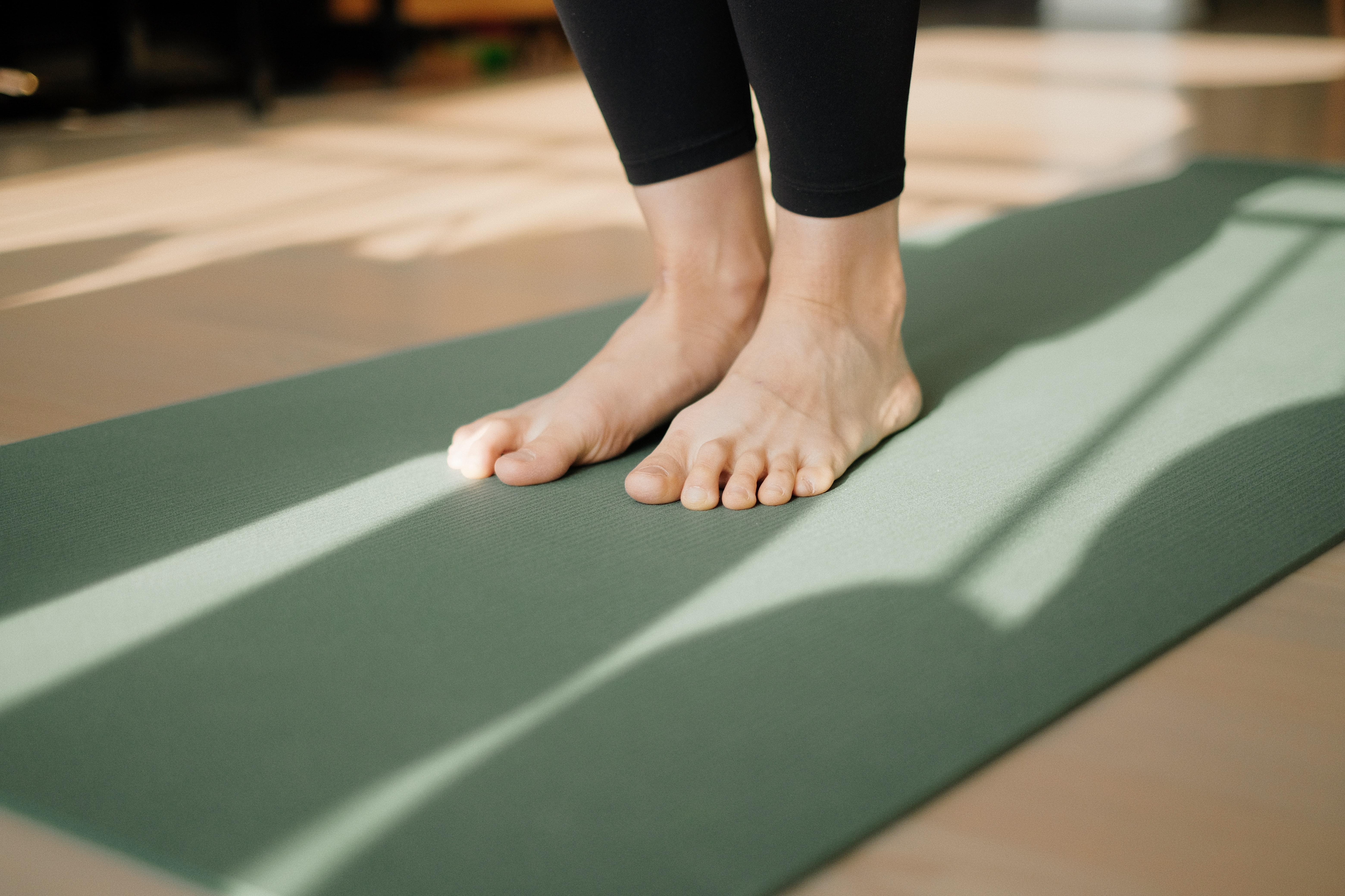 Bare feet on a yoga mat