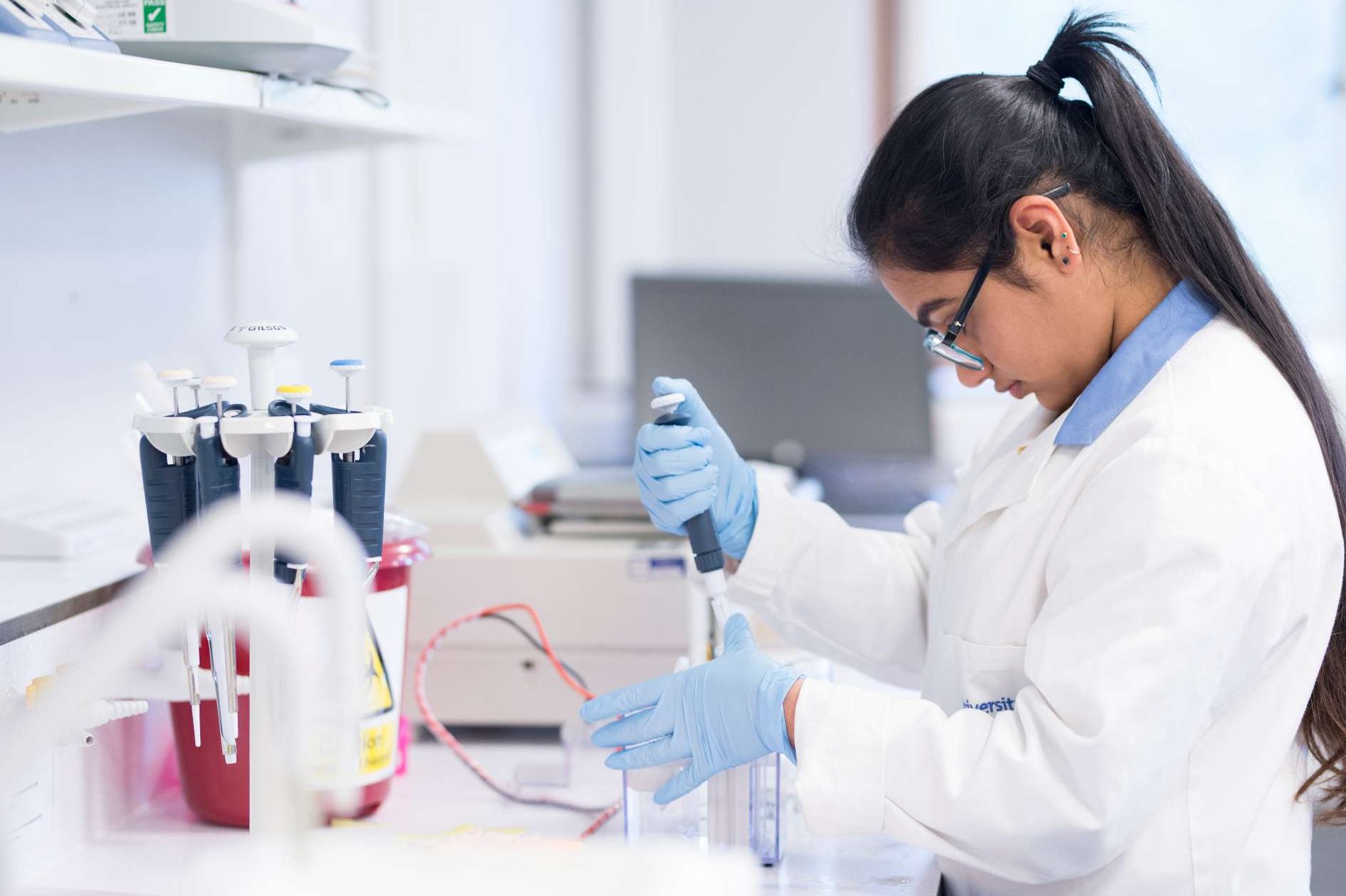 Girl in lab coat working in the laboratory