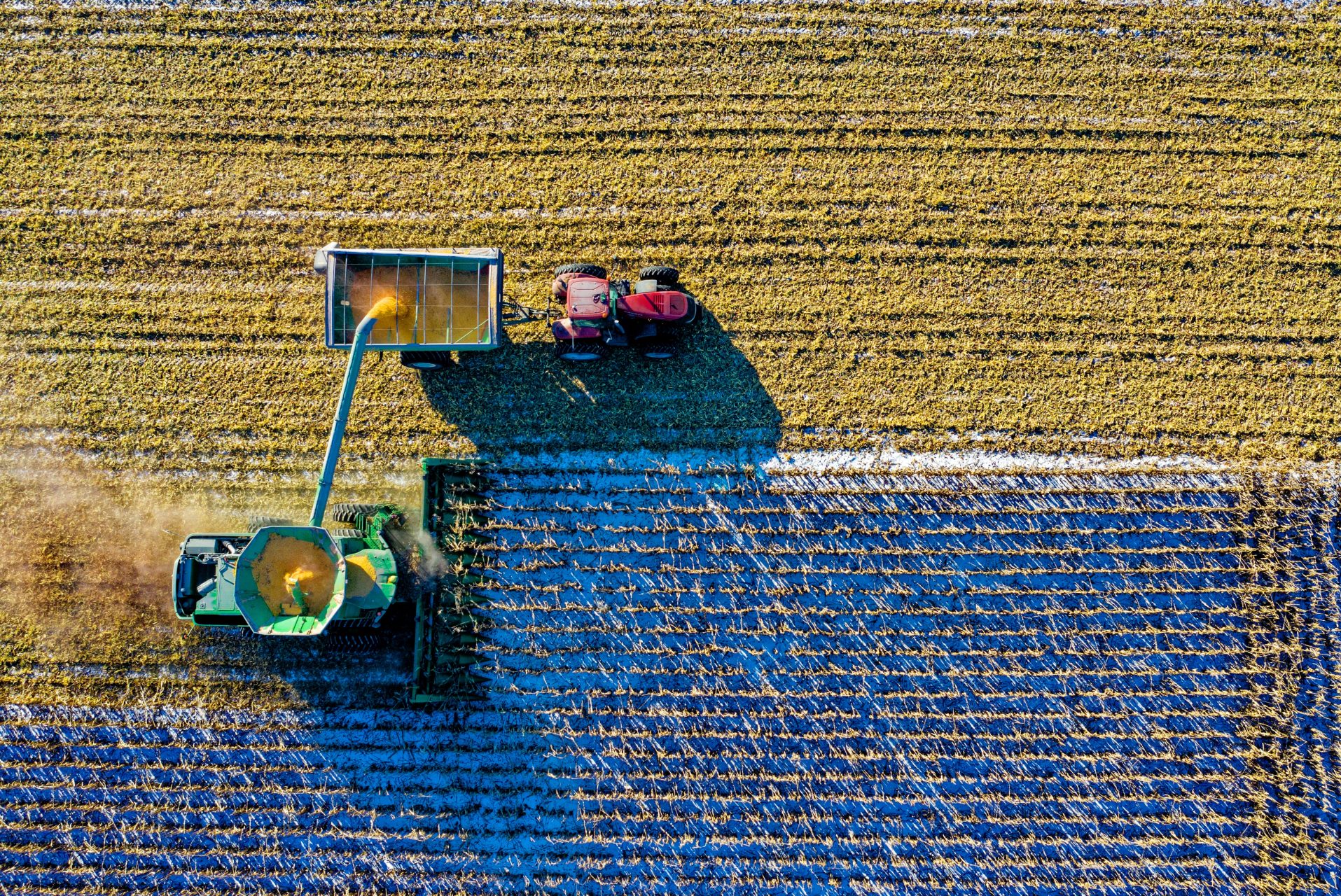 An agricultural field with farm machinery from above