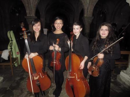 Faith Chan (l) with members of the cello section at the Cathedral Concert