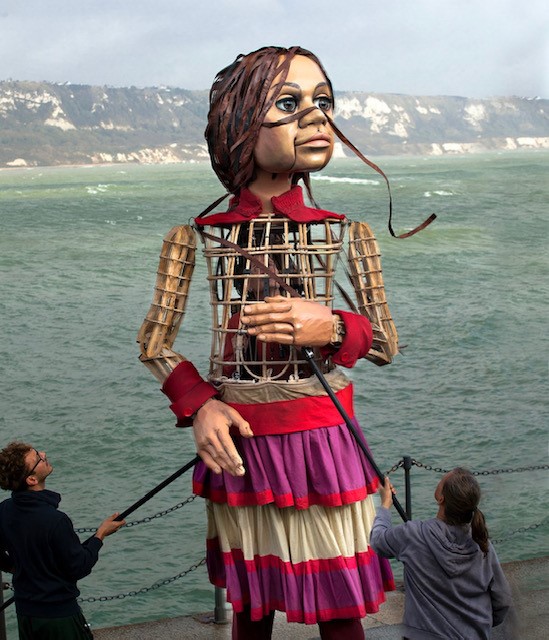 3.5 metres high, 9 year old refugee puppet Little Amal arrives on the Kent coast.