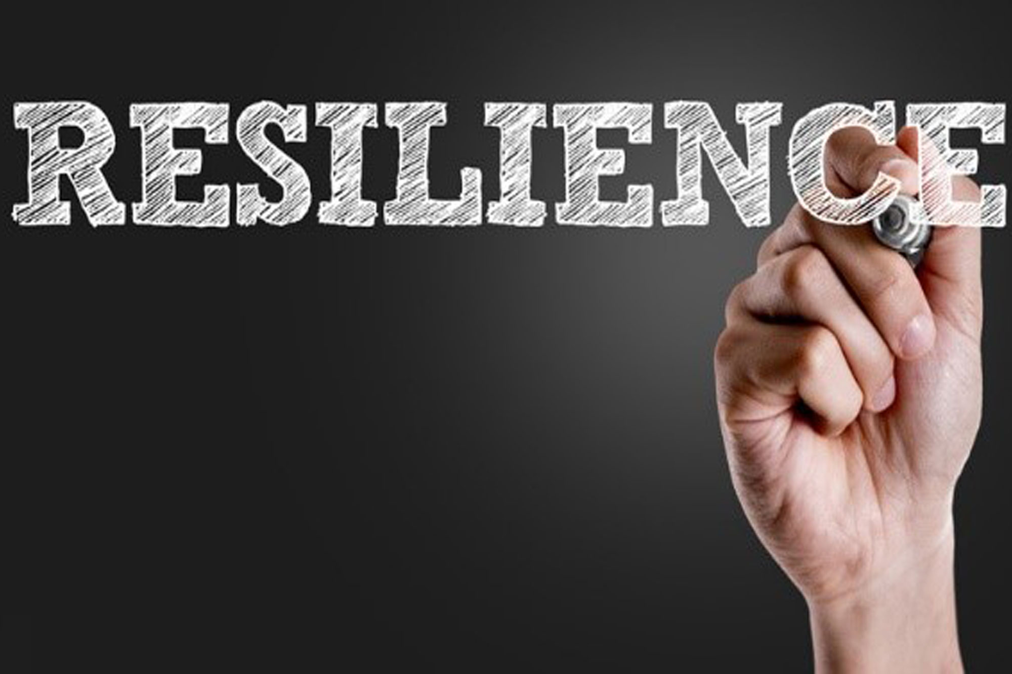 Resilience text with image of a strong, clenched fist