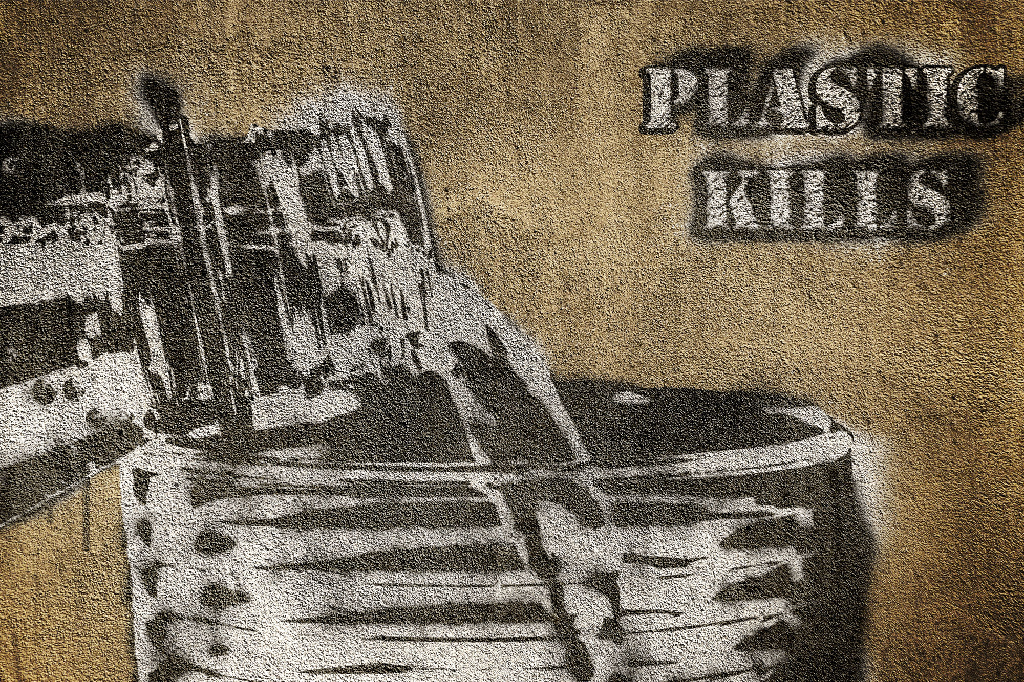 Stencilled graffiti with the slogan 'Plastic Kills'