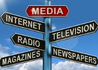 Signpost pointing to different varieties of media